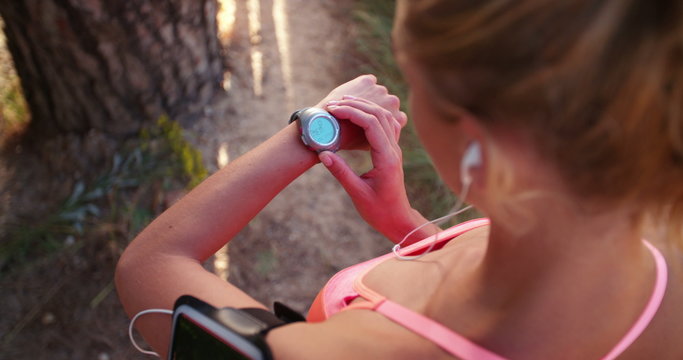 Woman Runner Checking Her Running Time On Sportswatch