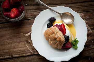 Berry and Lemon Curd Shortcake on Wood Background