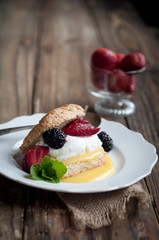 Berry and Lemon Curd Shortcake on Wood Background