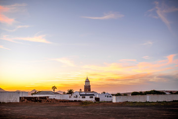 Wide angle view on Teguise village with church tower on the sunset on lanzarote island