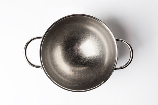 Stainless steel bowl on white background directly from above