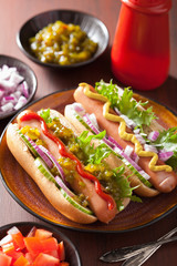 grilled hot dogs with vegetables ketchup mustard