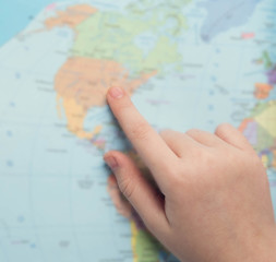 Young tourist couple looking world map will travel