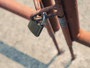 Padlock with old fence.
