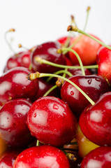Cherry with leaves isolated on white