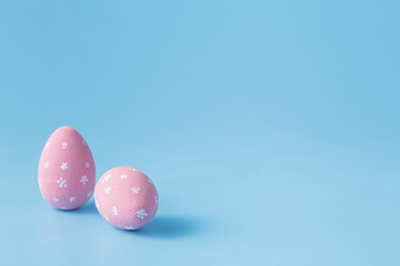 Fototapeta na wymiar Colored easter eggs on blue background