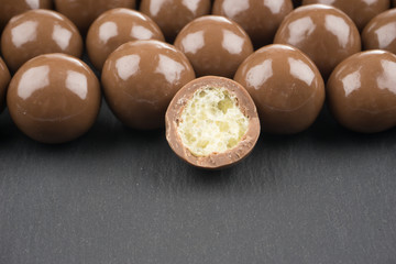 chocolate balls on a black background
