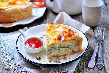 Pie with fish, rice and mushrooms. Russian traditions.