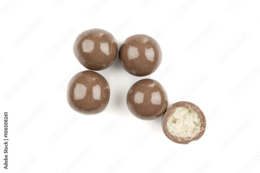 Wall mural chocolate balls on a white background