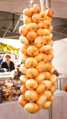 Appetizing fresh yellow bunch of onion on the spring fair