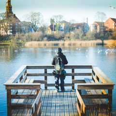 young tourist man taking photos of landscape near Christiania ,