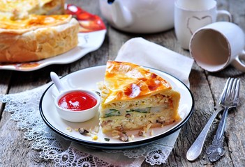 Pie with fish, rice and mushrooms. Russian traditions.