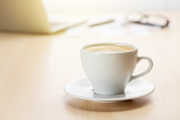 Obraz na płótnie Canvas Office workplace with laptop and coffee