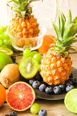 tropical fruit, pineapple, kiwi, red orange and blueberries
