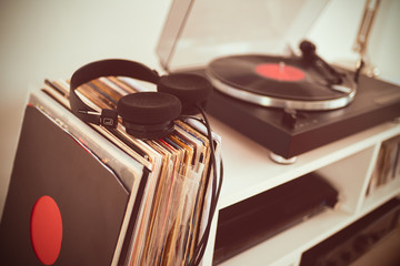 Analog Stereo Turntable Vinyl Record Player. Vinyl collection. Headphones on Vinyls.