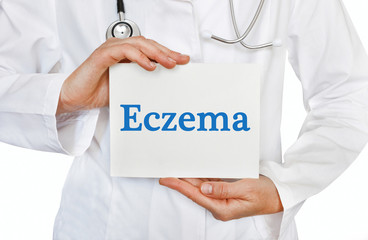 Doctor holding a card with Eczema, medical concept