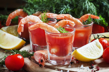 Seafood appetizer: shrimp with tomato sauce, herbs and spices, s