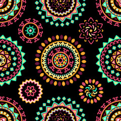 Seamless pattern of bright colorful geometric round ethnic decorative elements. Vector mandala background with bohemian, Oriental, Indian, Arabic, Aztec motifs.