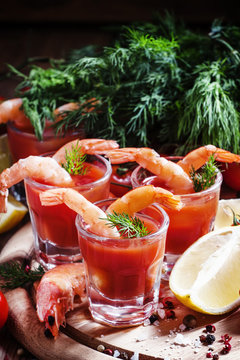 Seafood appetizer: shrimp with tomato sauce, herbs and spices, s