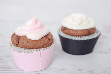 Cupcakes with sour cream frosting on top