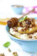Oat porridge with caramelized pear and walnuts.