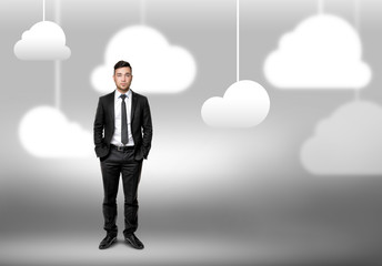 Man standing on blurred background with clouds