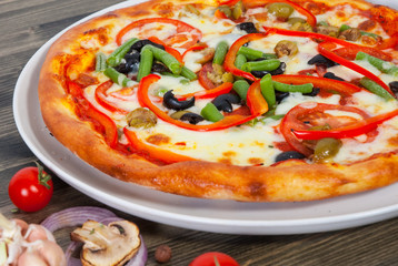 pizza with vegetables on plate