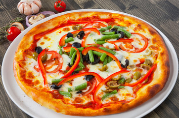 pizza with vegetables on plate