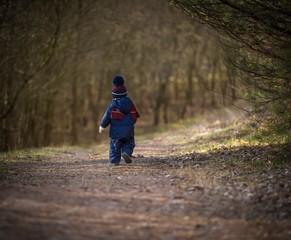 Fototapeta premium Caucasian boy playing outdoor at springtime