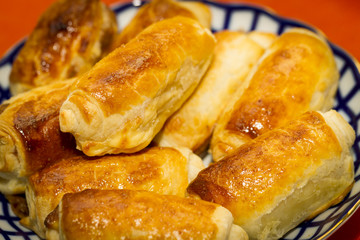 Beautiful, red-cheeked, golden pastries - croissants and puff pa