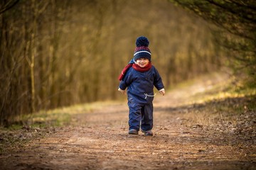 Caucasian boy playing outdoor at springtime