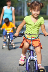 Fototapeta na wymiar little girl on bicycle