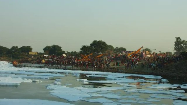 Time Lapse shot of people at riverbank, Yamuna River, Delhi, India