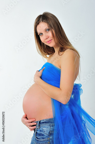 Blue Pregnant Lady Naked - pregnant girl is posing with naked belly on white background ...