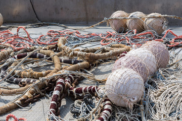 Fishing ropes and floats on the deck of the fishing boat