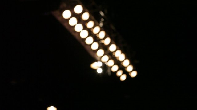 A rack-focus shot of stage lights