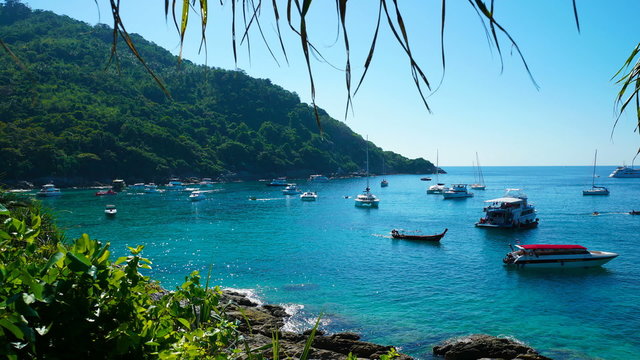 Yachts, speed boats moored in a marine lagoon. Time lapse