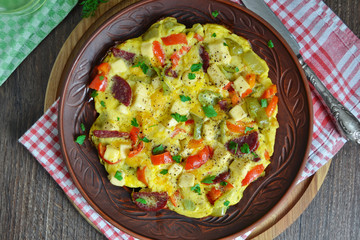 Frittata with peppers, salami and cheese, Italian breakfast