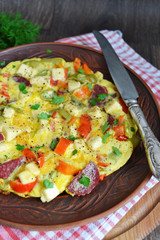 Frittata with peppers, salami and cheese, Italian breakfast