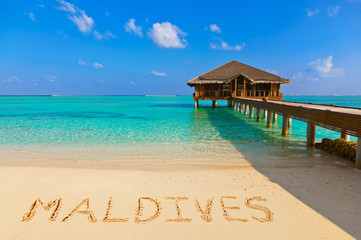 Word Maldives on beach