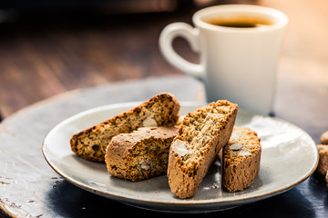 Strong coffee served with italian cantucci - obrazy, fototapety, plakaty