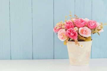 Naklejka premium Pastel Artificial Pink Rose in flower pot