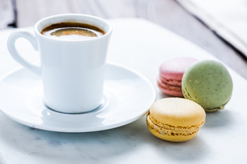 coffee cup and sweet treat macaroon