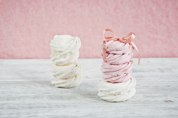 Homemade sweet pink and white marshmallow - zephyr on a light wo