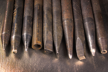 Old hand iron punchers and chisels