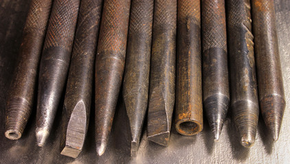 Old rusty hand iron punchers and chisels