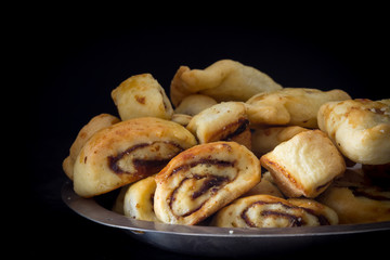 Klecha Iraqi Date Cookies on a Platter with Dark Background Horizontal