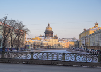 St. Petersburg in the winter. View dome of St. Isaac's Cathedral and the Moika River architecture bridge Potseluev (Kissing bridge)