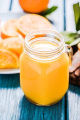 Vintage jar with fresh orange juice