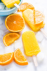 Fototapeta na wymiar Homemade, natural orange ,refreshing summer popsicle